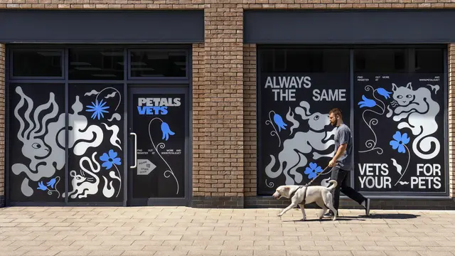 Vet practice London with pet-themed artwork and text, showing a man walking a dog outside. The signs promote Petal Vets, a veterinary clinic.