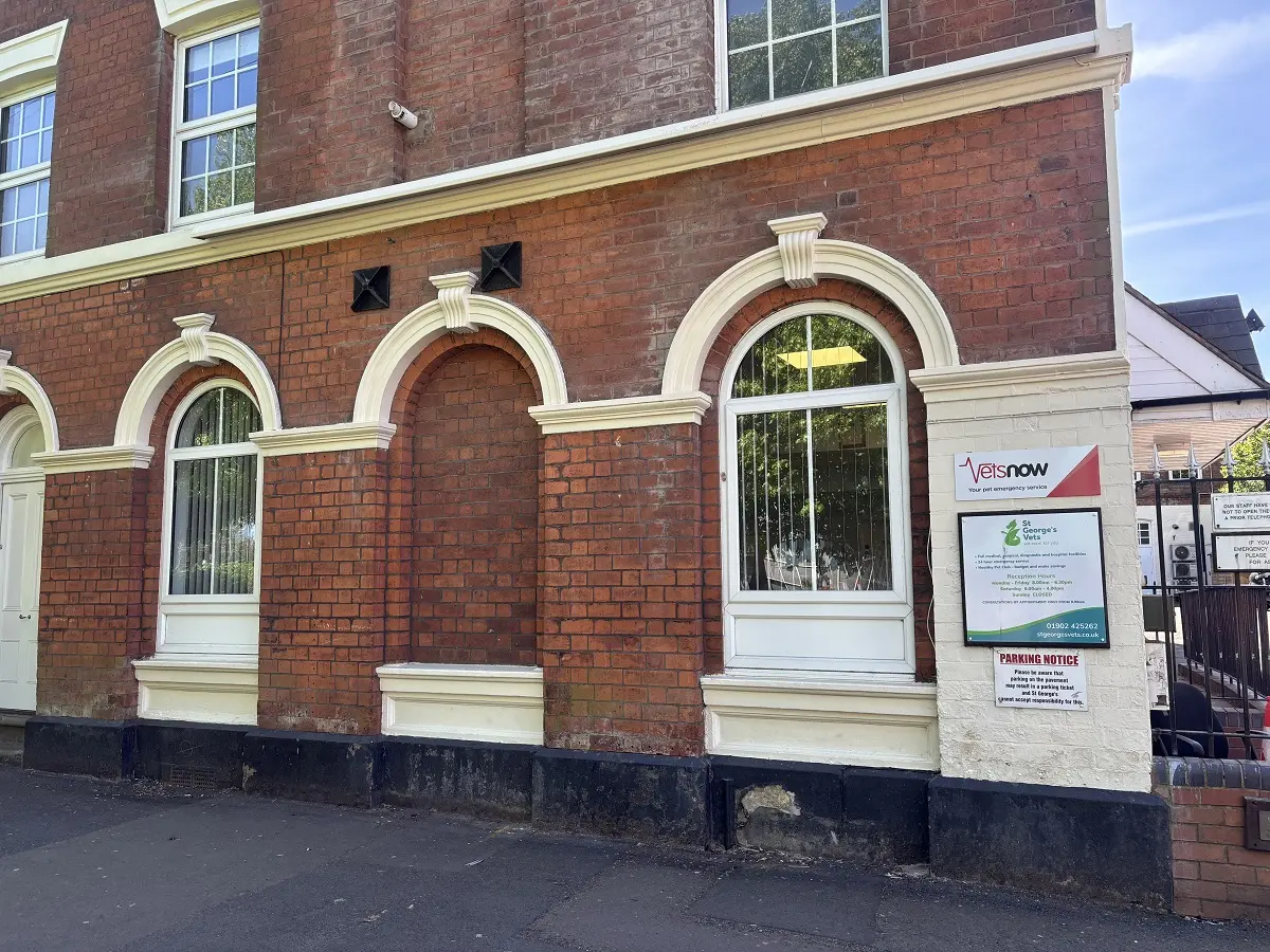 Brick front of St George’s Vets in Wolverhampton with large arched windows and visible Vets Now partnership sign beside the clinic's branding.